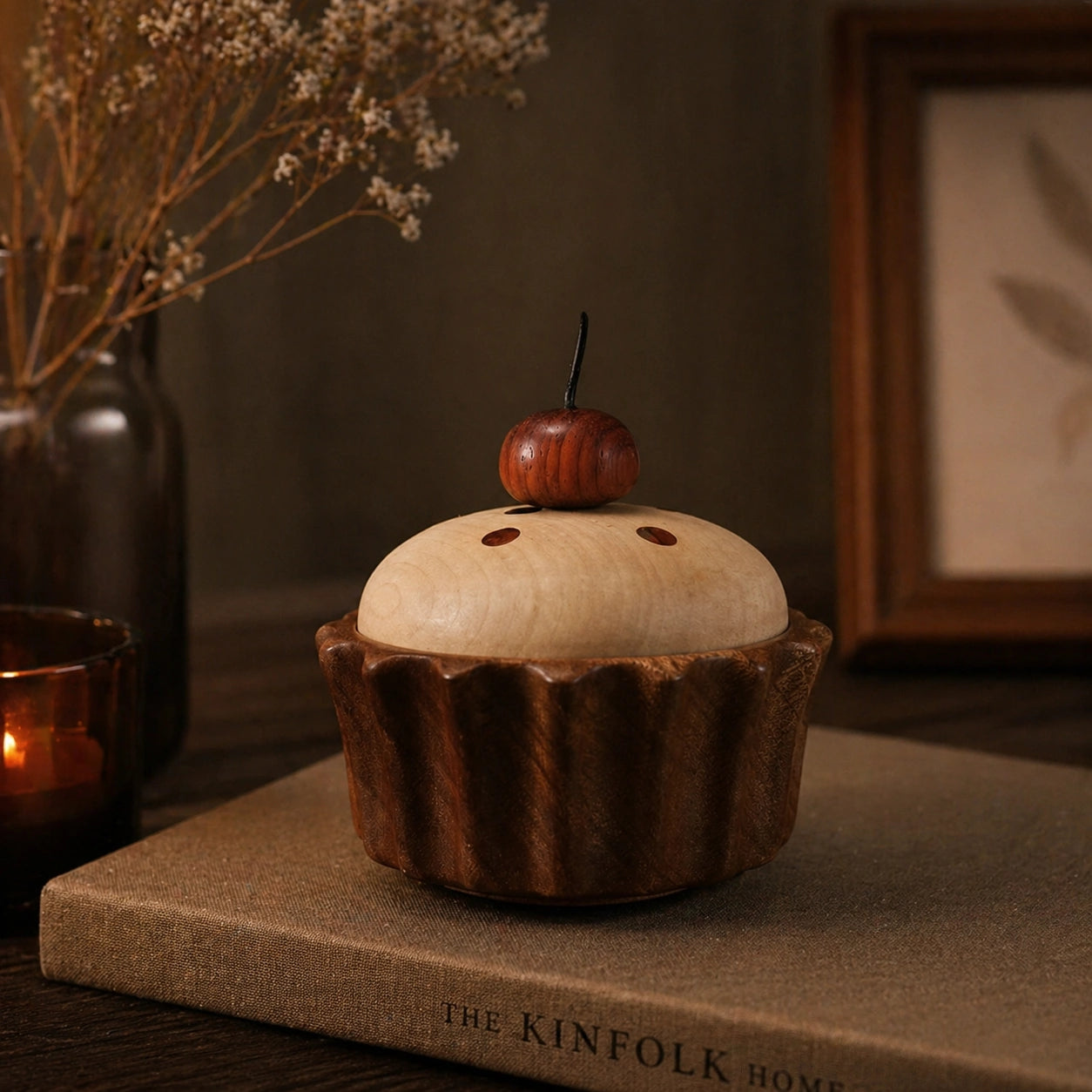 Cute cupcake wooden storage box with cherry lid on a wooden shelf